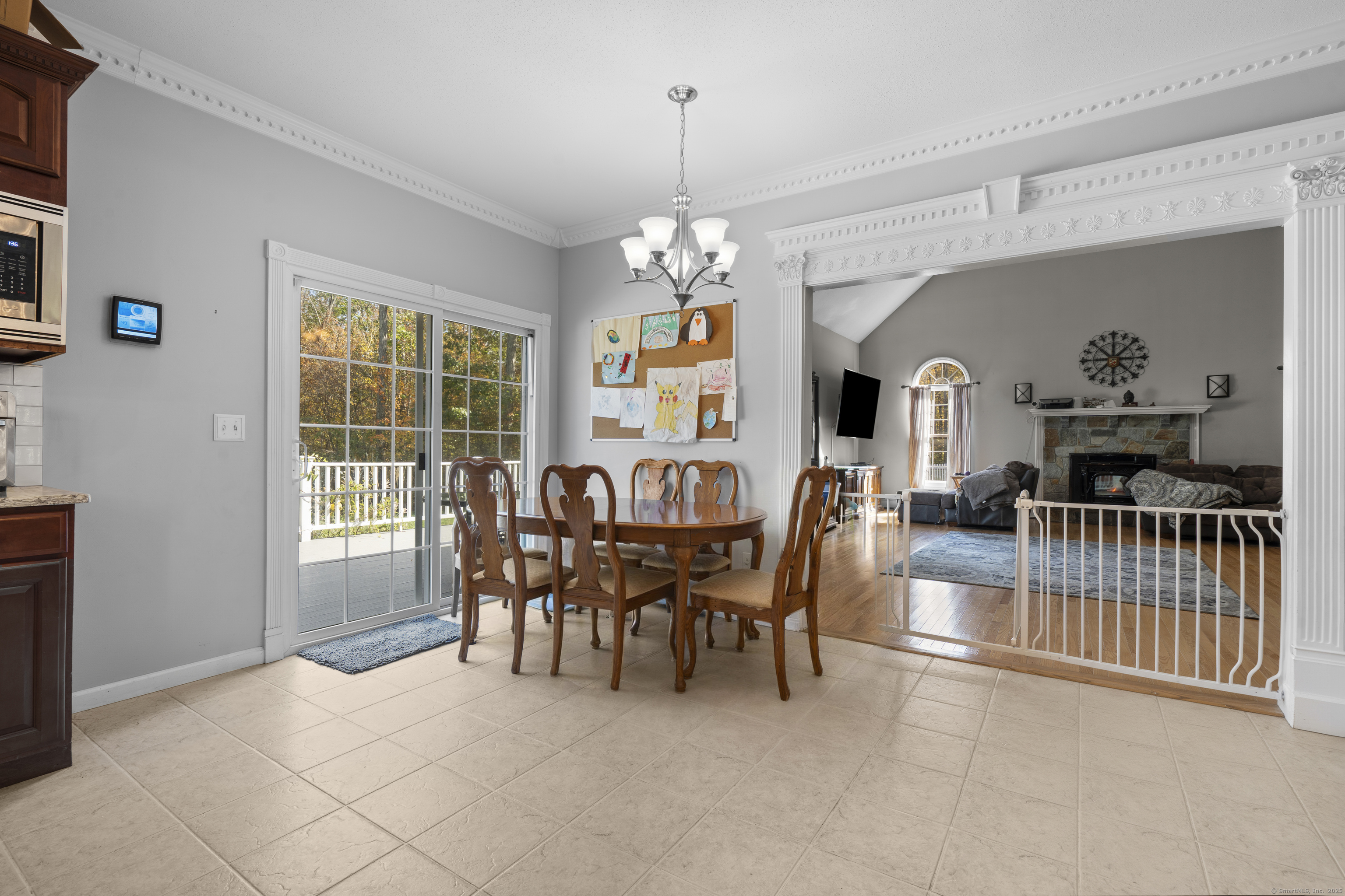 63 Taylor Road Colchester, CT 06415 - Photo 6 of 40 a dining room with furniture a chandelier and window