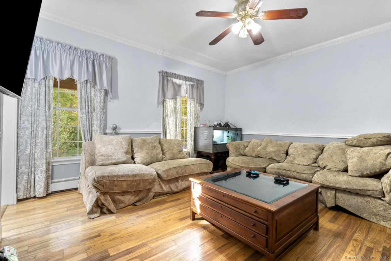 63 Taylor Road Colchester, CT 06415 - Photo 9 of 40 a living room with furniture and a large window