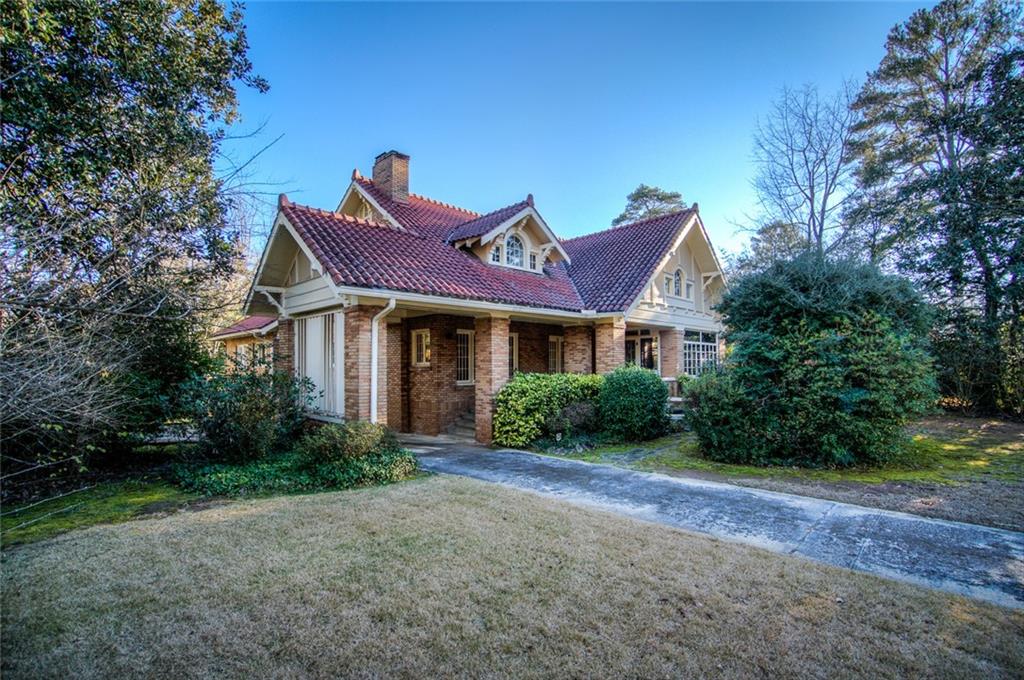 1201 Springdale Road Northeast Atlanta, GA 30306 - Photo 1 of 1 a front view of a house with garden