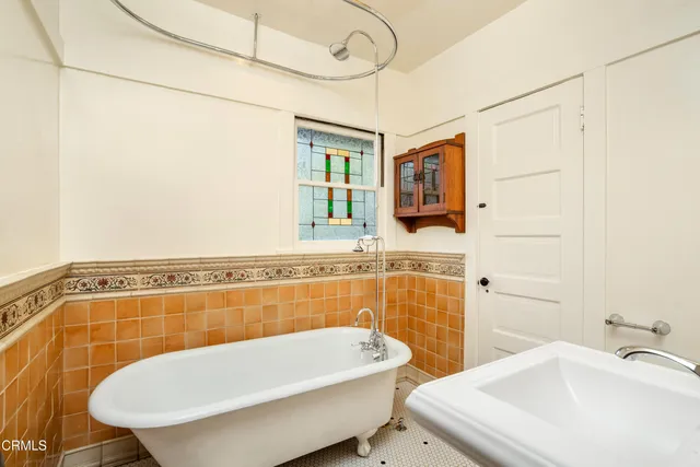 a view of a water fountain with potted plants