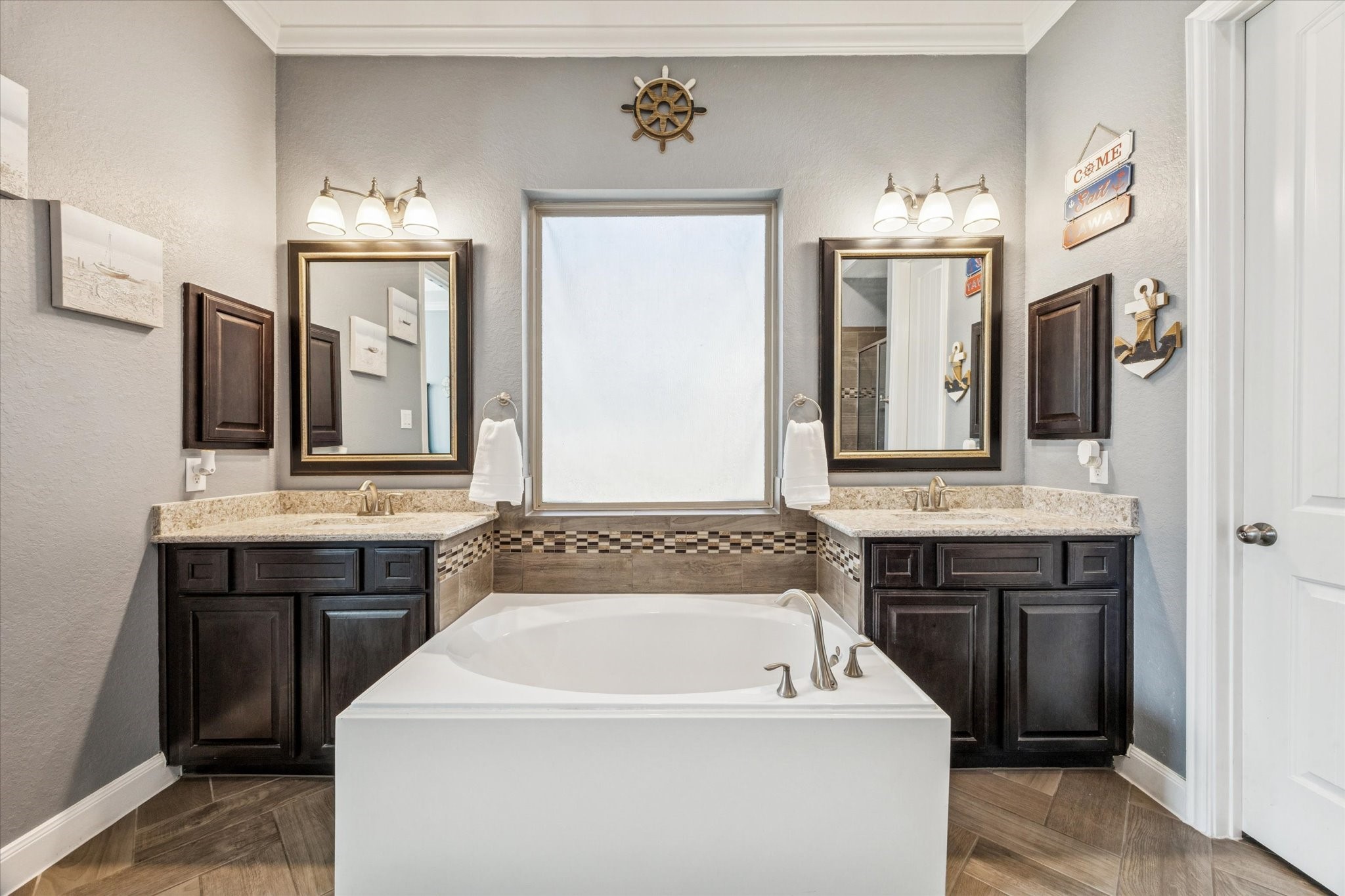 2283 Rising Bay Court League City, TX 77573 - Photo 20 of 45 Tub and vanities in the primary bathroom.