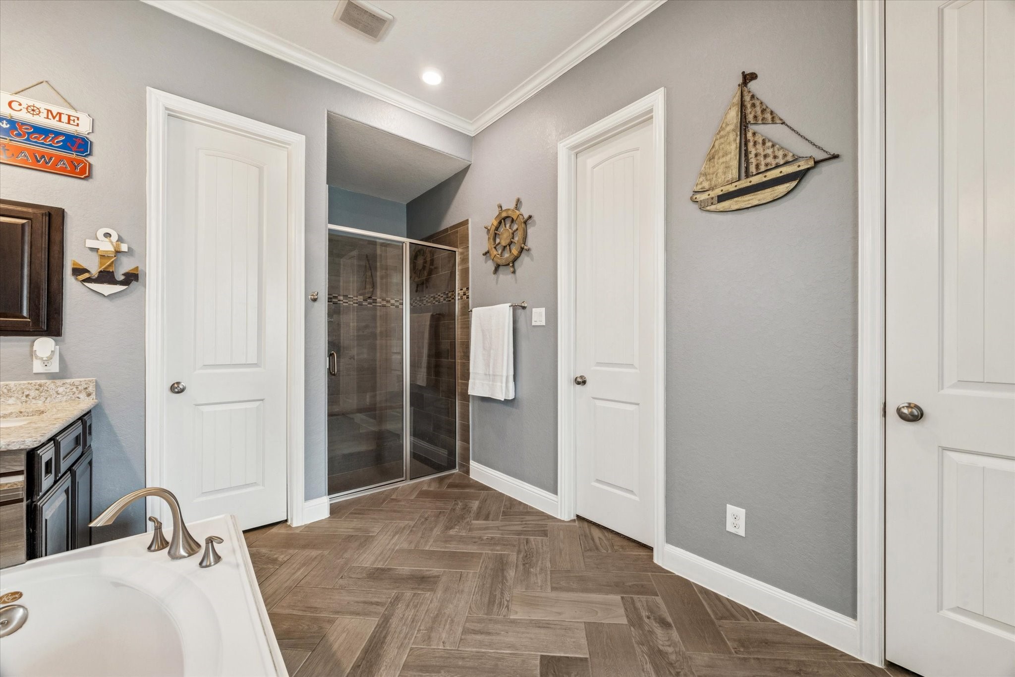 2283 Rising Bay Court League City, TX 77573 - Photo 21 of 45 Another view of the primary bathroom showcasing the designer tile pattern featured throughout the home.