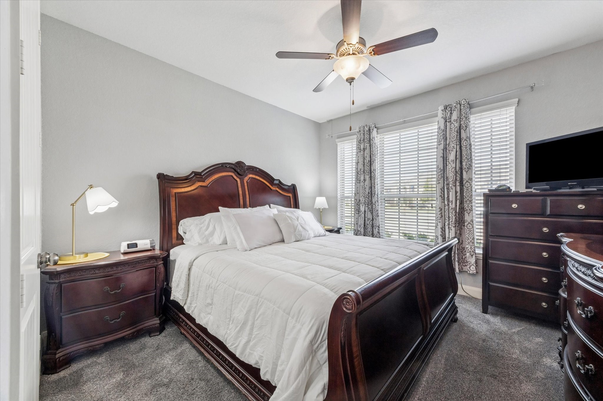 2283 Rising Bay Court League City, TX 77573 - Photo 32 of 45 a bedroom with a bed and a flat screen tv