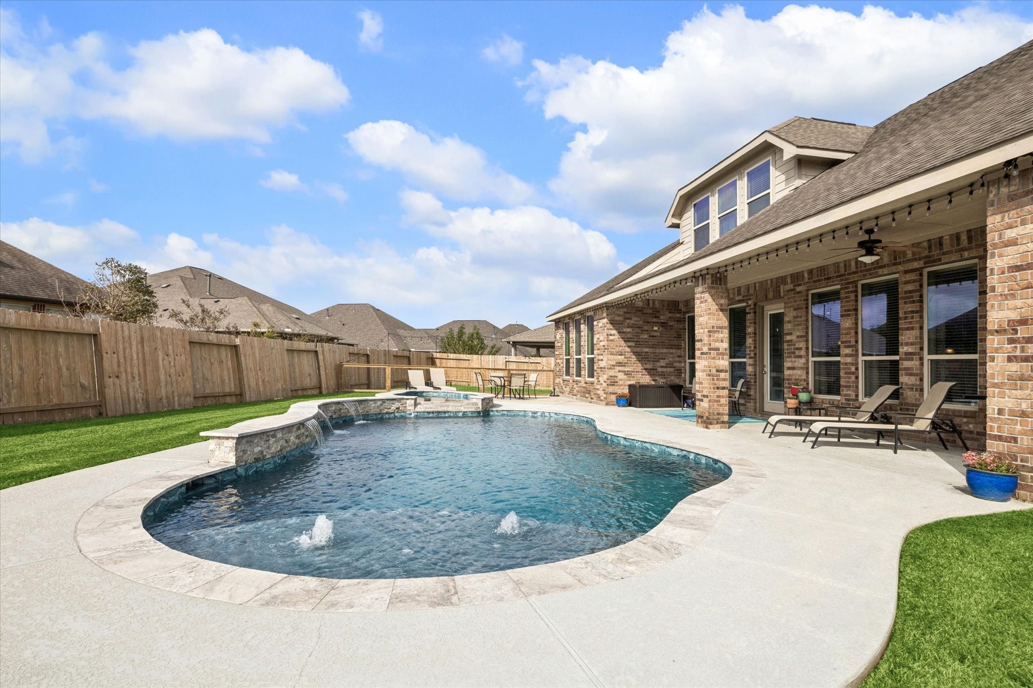 2283 Rising Bay Court League City, TX 77573 - Photo 40 of 45 a view of a house with a swimming pool and sitting area