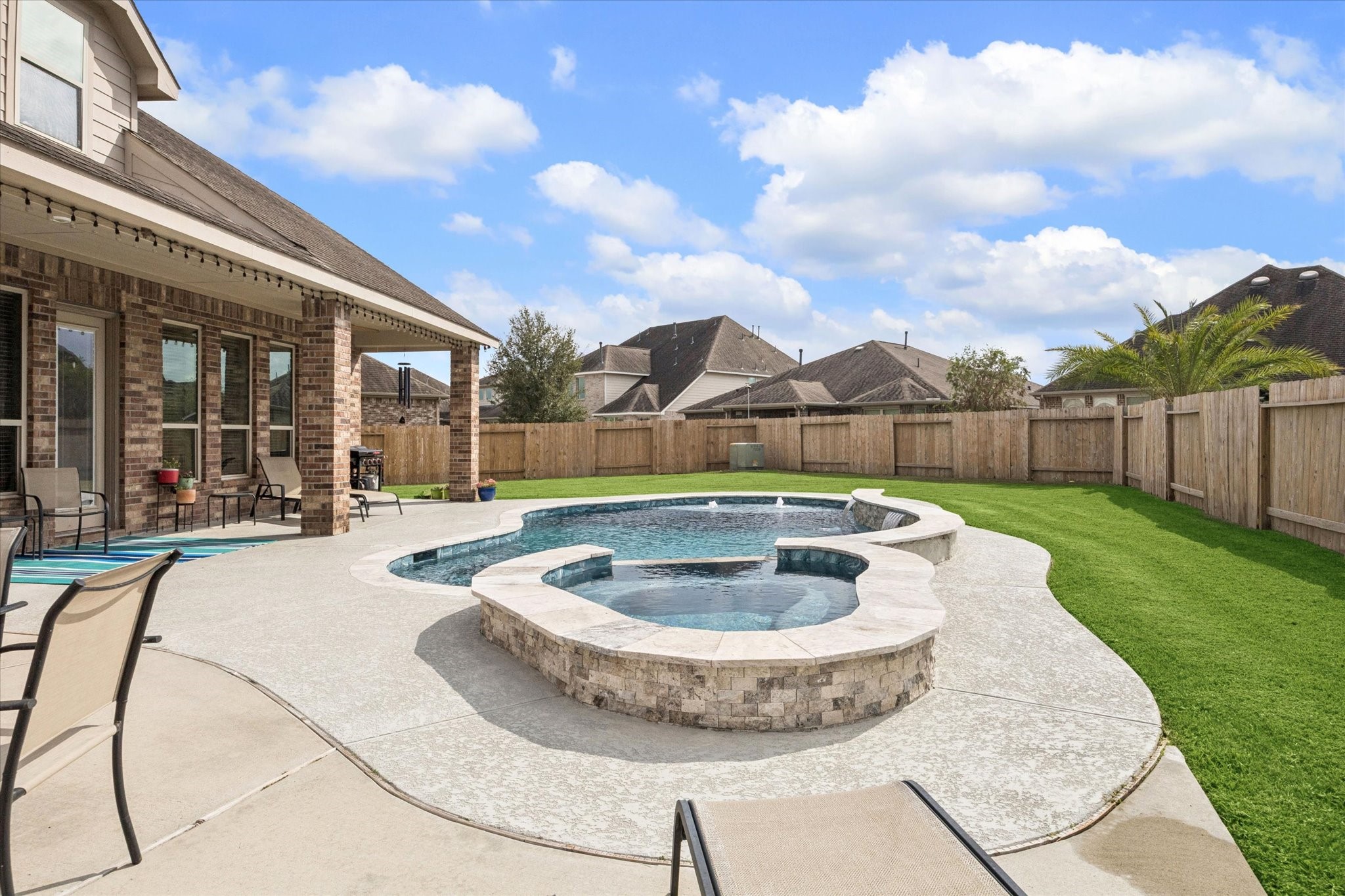 2283 Rising Bay Court League City, TX 77573 - Photo 42 of 45 a view of a swimming pool with a sitting space