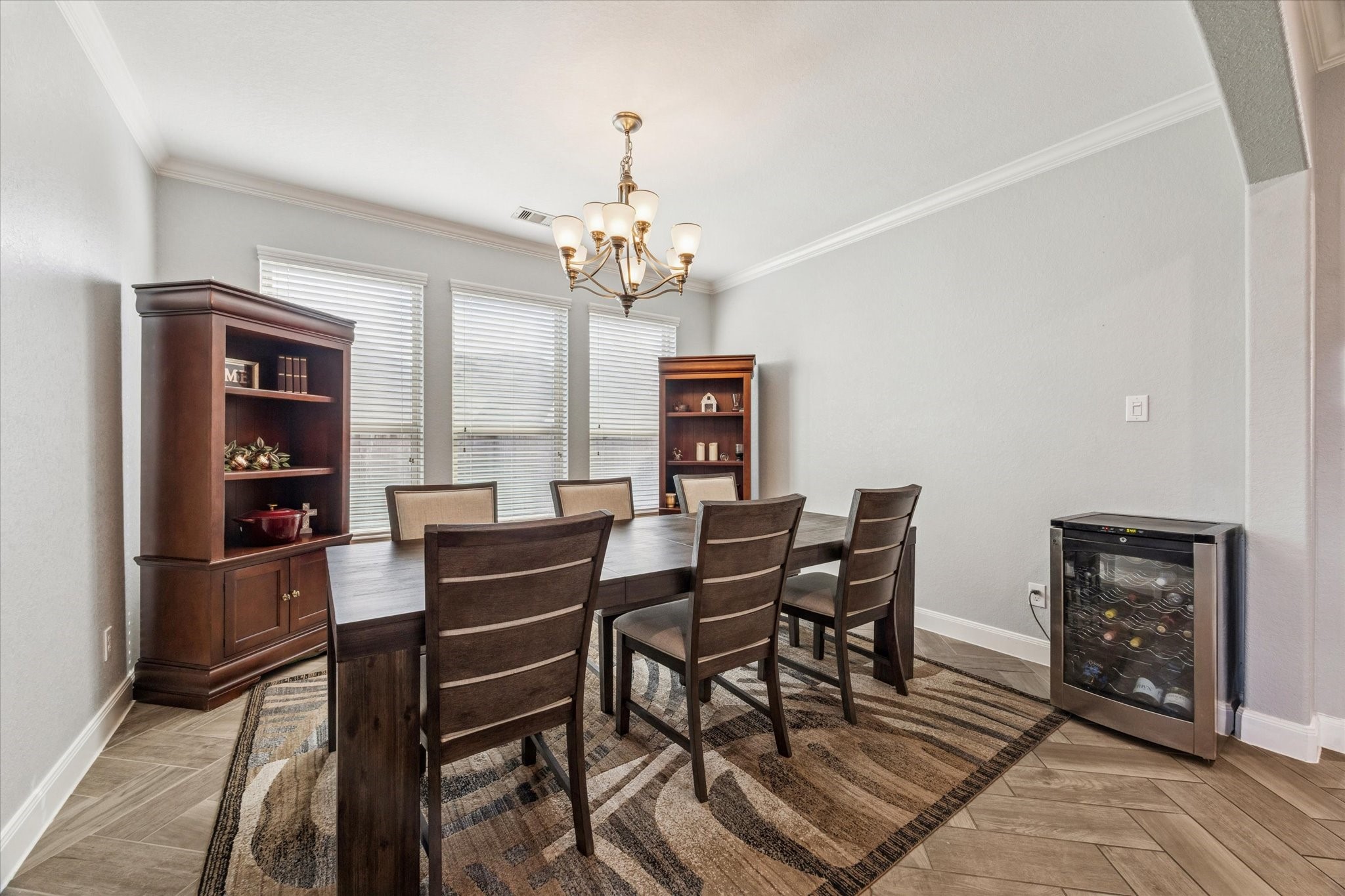 2283 Rising Bay Court League City, TX 77573 - Photo 7 of 45 a view of a dining room with furniture and a chandelier