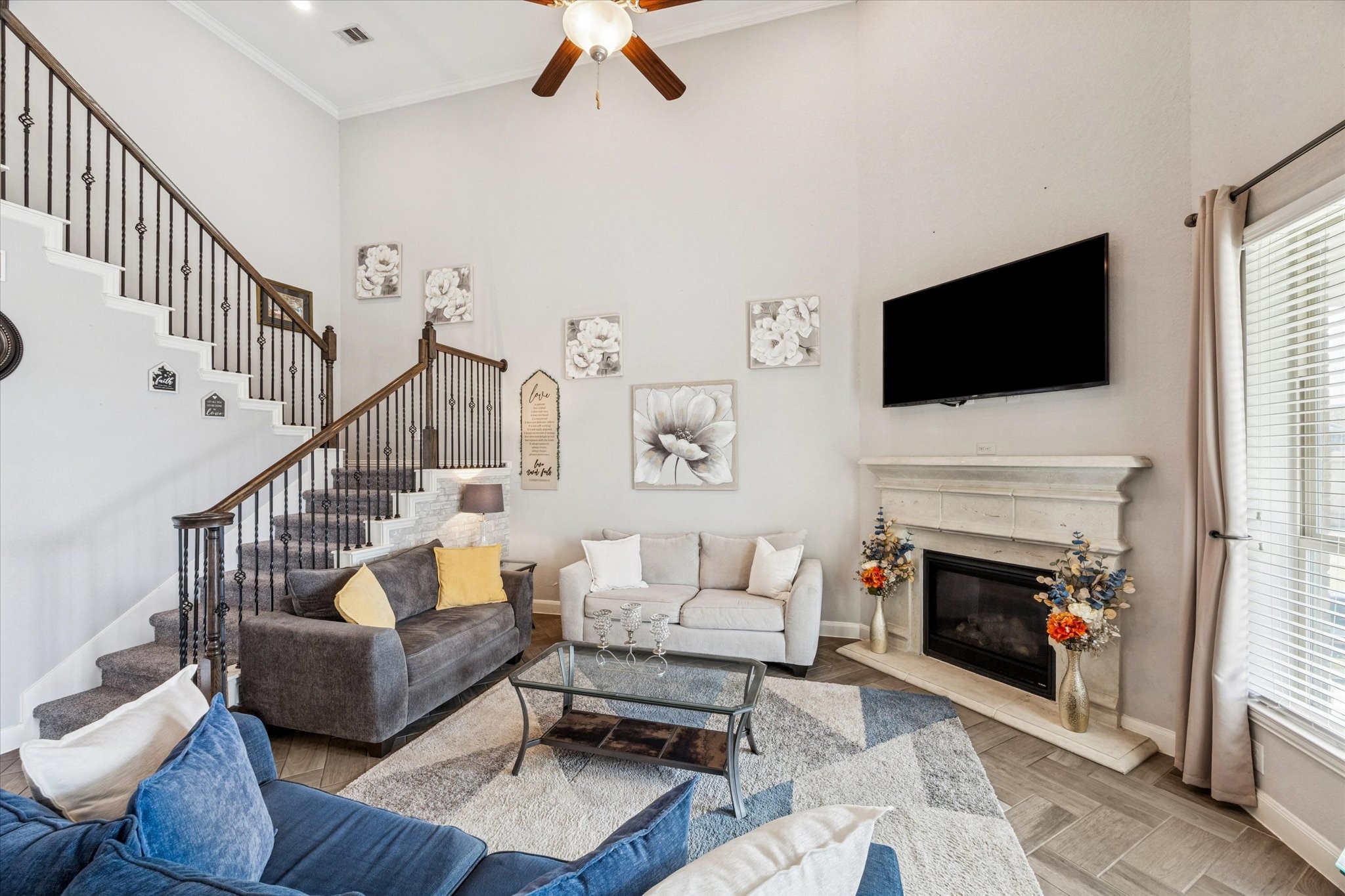 2283 Rising Bay Court League City, TX 77573 - Photo 10 of 45 a living room with furniture a fireplace and a flat screen tv