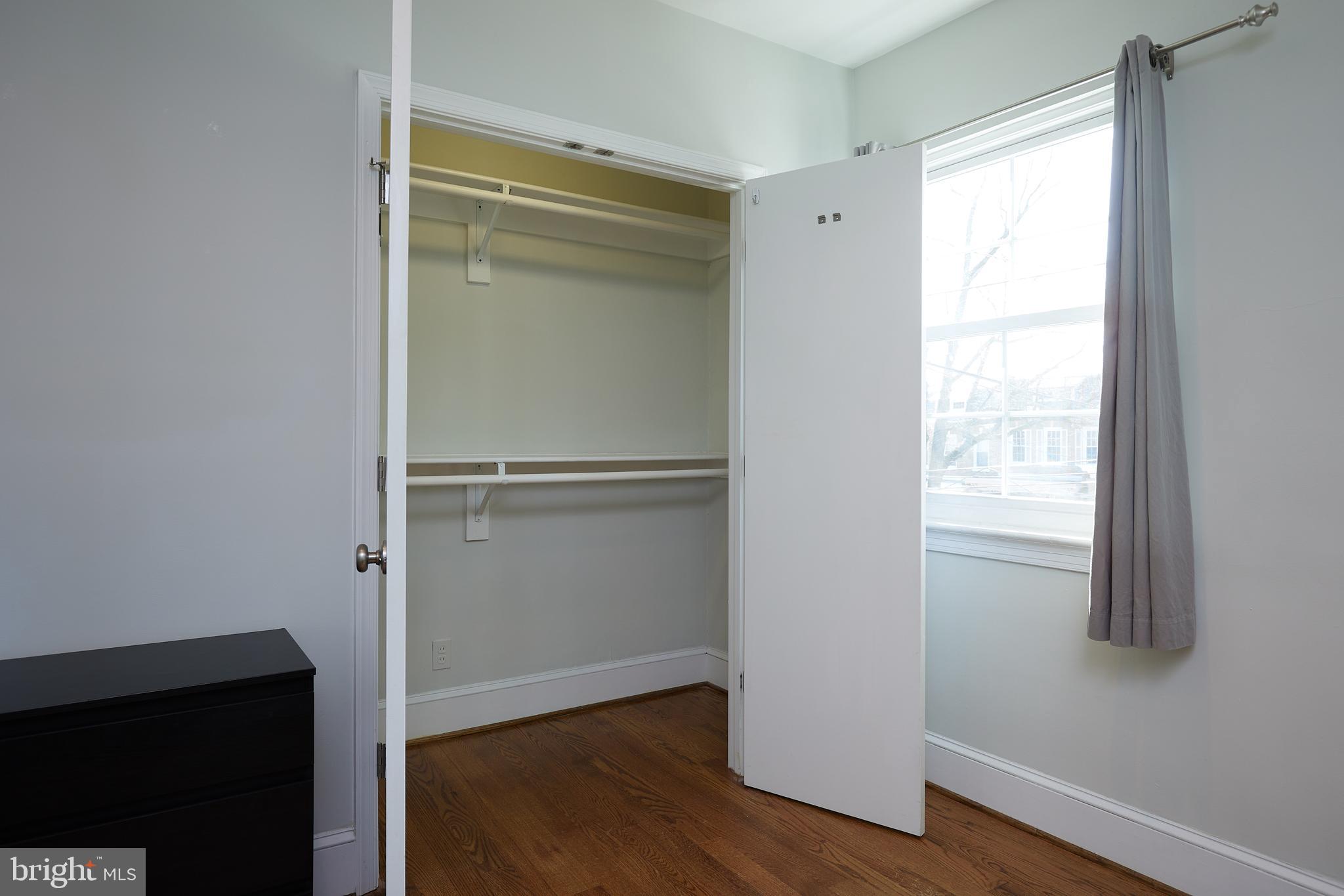 421 Longfellow Street Northwest Washington, DC 20011 - Photo 23 of 58 a room with wooden floor and a window