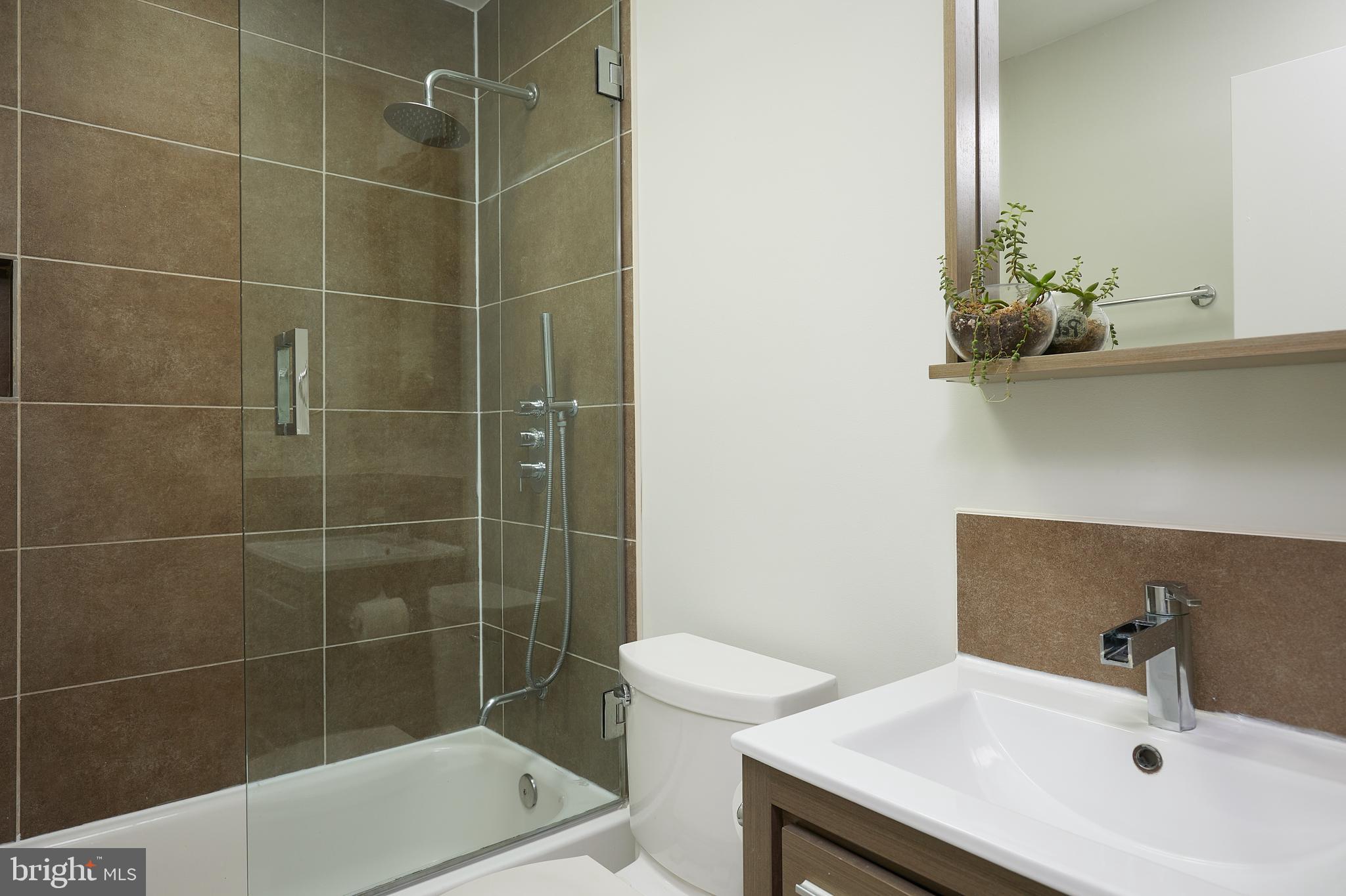421 Longfellow Street Northwest Washington, DC 20011 - Photo 24 of 58 a bathroom with a sink toilet and shower