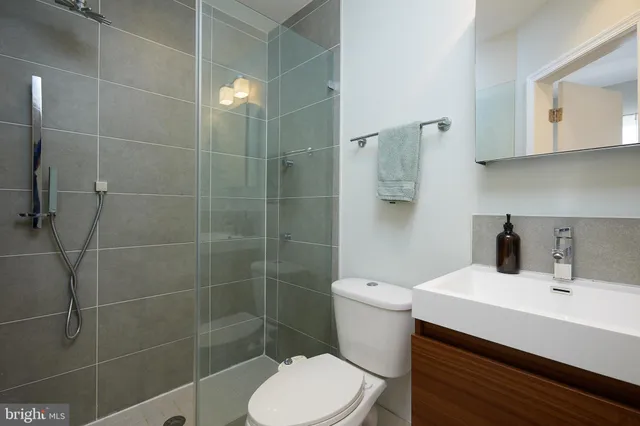 a view of a workspace with furniture and wooden floor