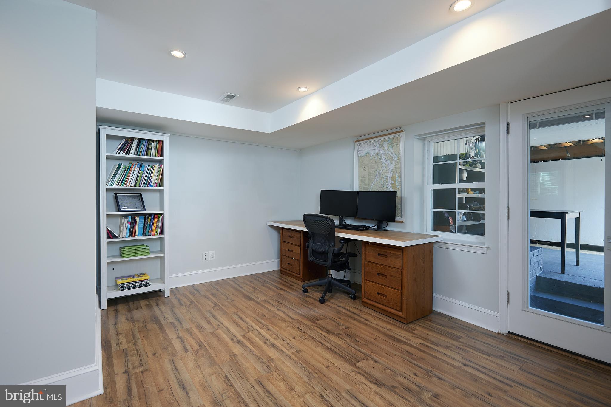 421 Longfellow Street Northwest Washington, DC 20011 - Photo 29 of 58 a view of a workspace with furniture and wooden floor
