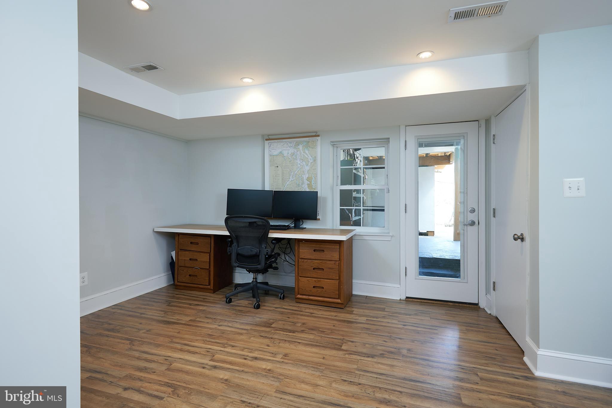 421 Longfellow Street Northwest Washington, DC 20011 - Photo 30 of 58 a view of a workspace with furniture and wooden floor