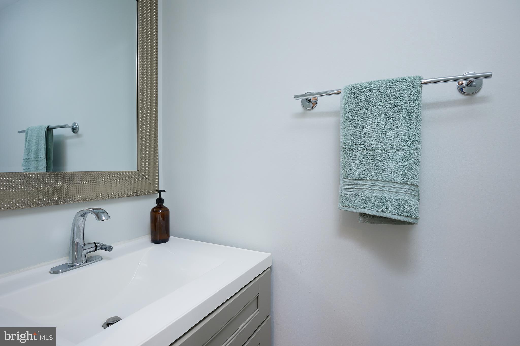 421 Longfellow Street Northwest Washington, DC 20011 - Photo 36 of 58 a bathroom with a sink and a mirror