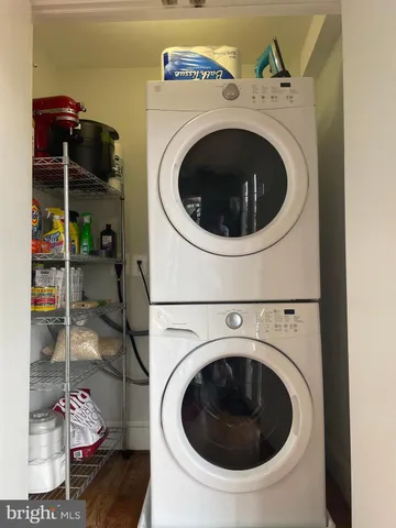 a view of a chairs and table in backyard