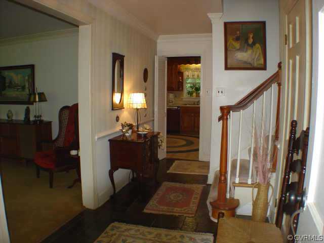 13361 Kingsmill Road Midlothian, VA 23113 - Photo 2 of 8 a living room with furniture and a fireplace