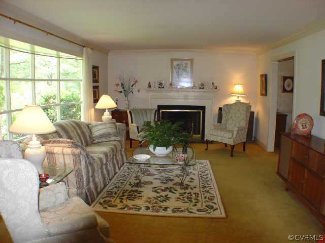 13361 Kingsmill Road Midlothian, VA 23113 - Photo 3 of 8 a living room with furniture and a fireplace
