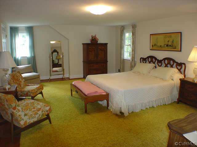13361 Kingsmill Road Midlothian, VA 23113 - Photo 7 of 8 a bed room with a bed and a couch