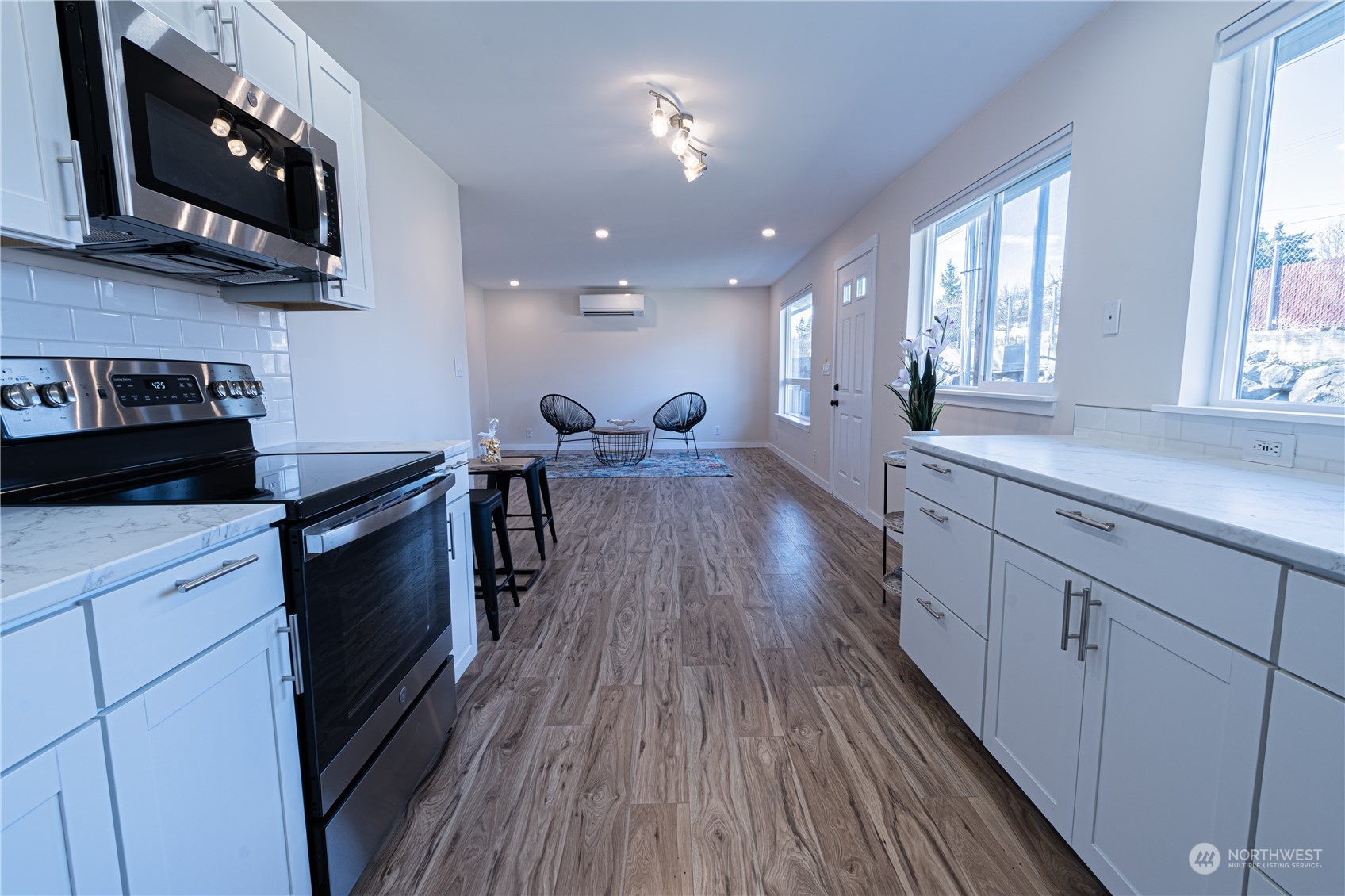1125 Southwest 356th Street Federal Way, WA 98023 - Photo 11 of 27 a kitchen with wooden floors and appliances
