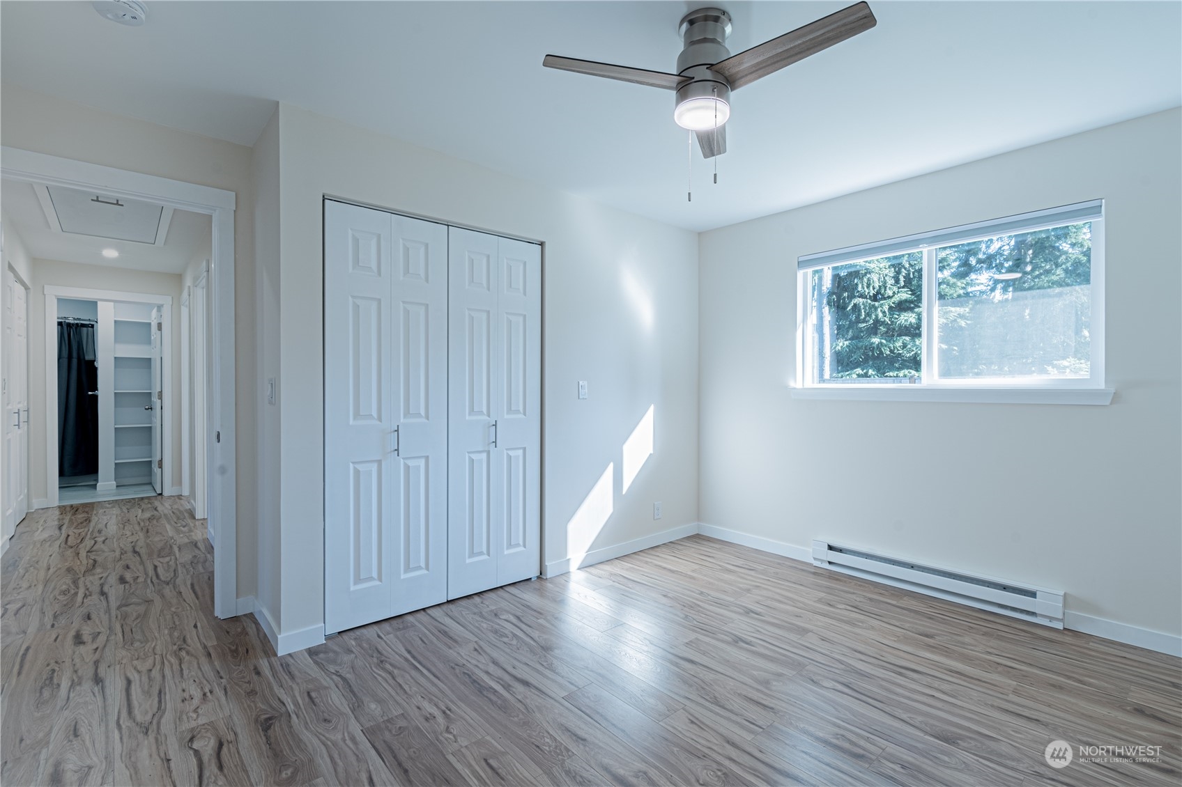 1125 Southwest 356th Street Federal Way, WA 98023 - Photo 13 of 27 an empty room with wooden floor chandelier fan and windows