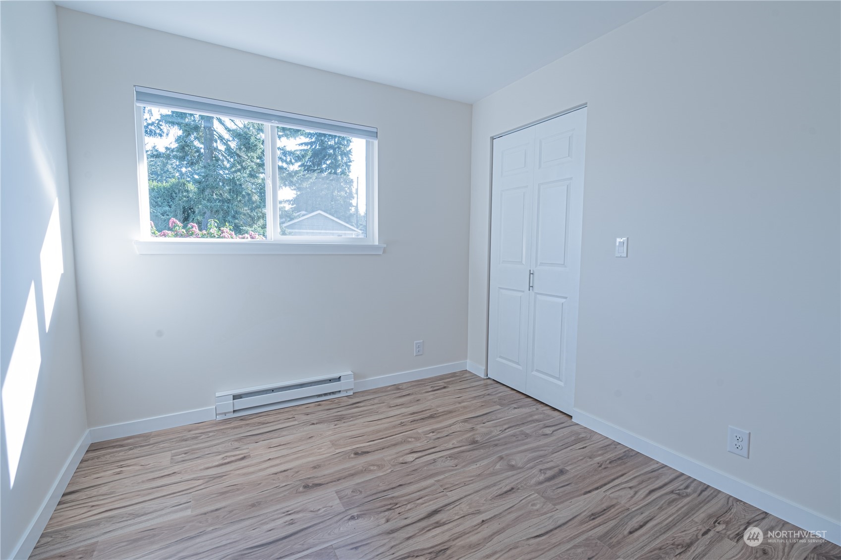 1125 Southwest 356th Street Federal Way, WA 98023 - Photo 16 of 27 an empty room with wooden floor and windows