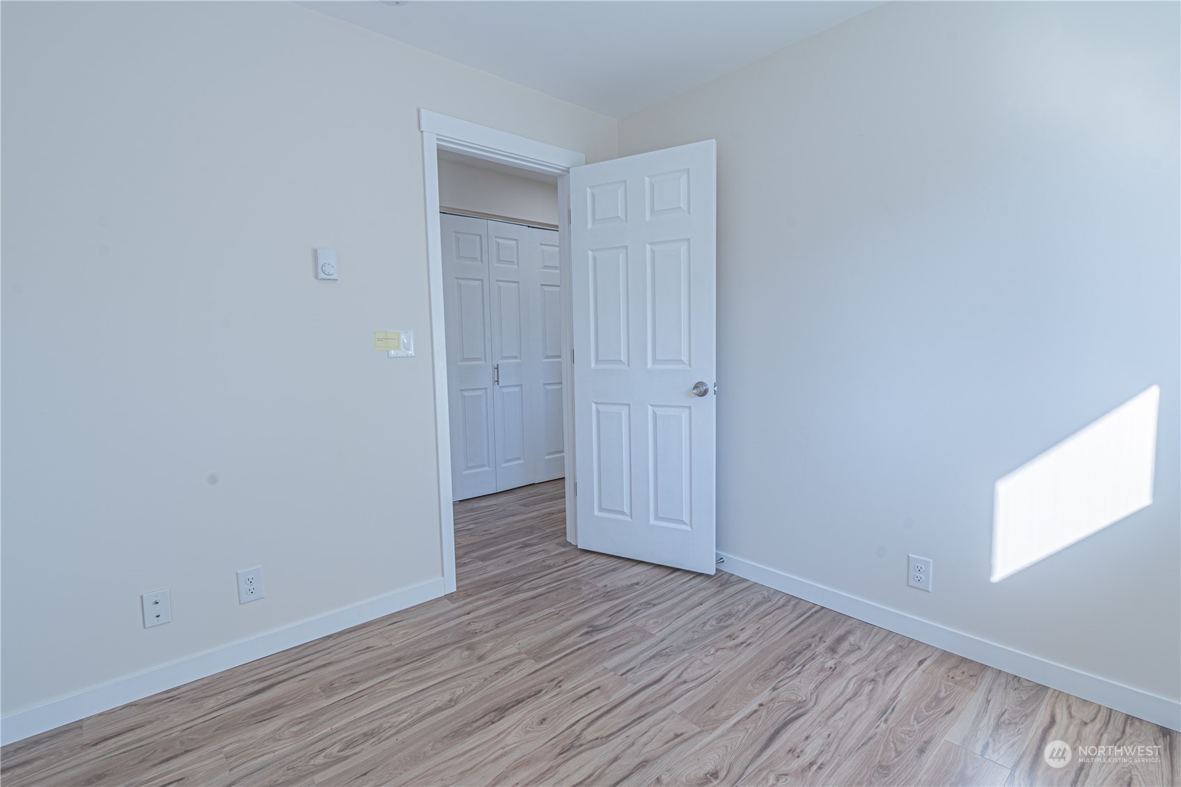 1125 Southwest 356th Street Federal Way, WA 98023 - Photo 17 of 27 a view of an empty room with wooden floor