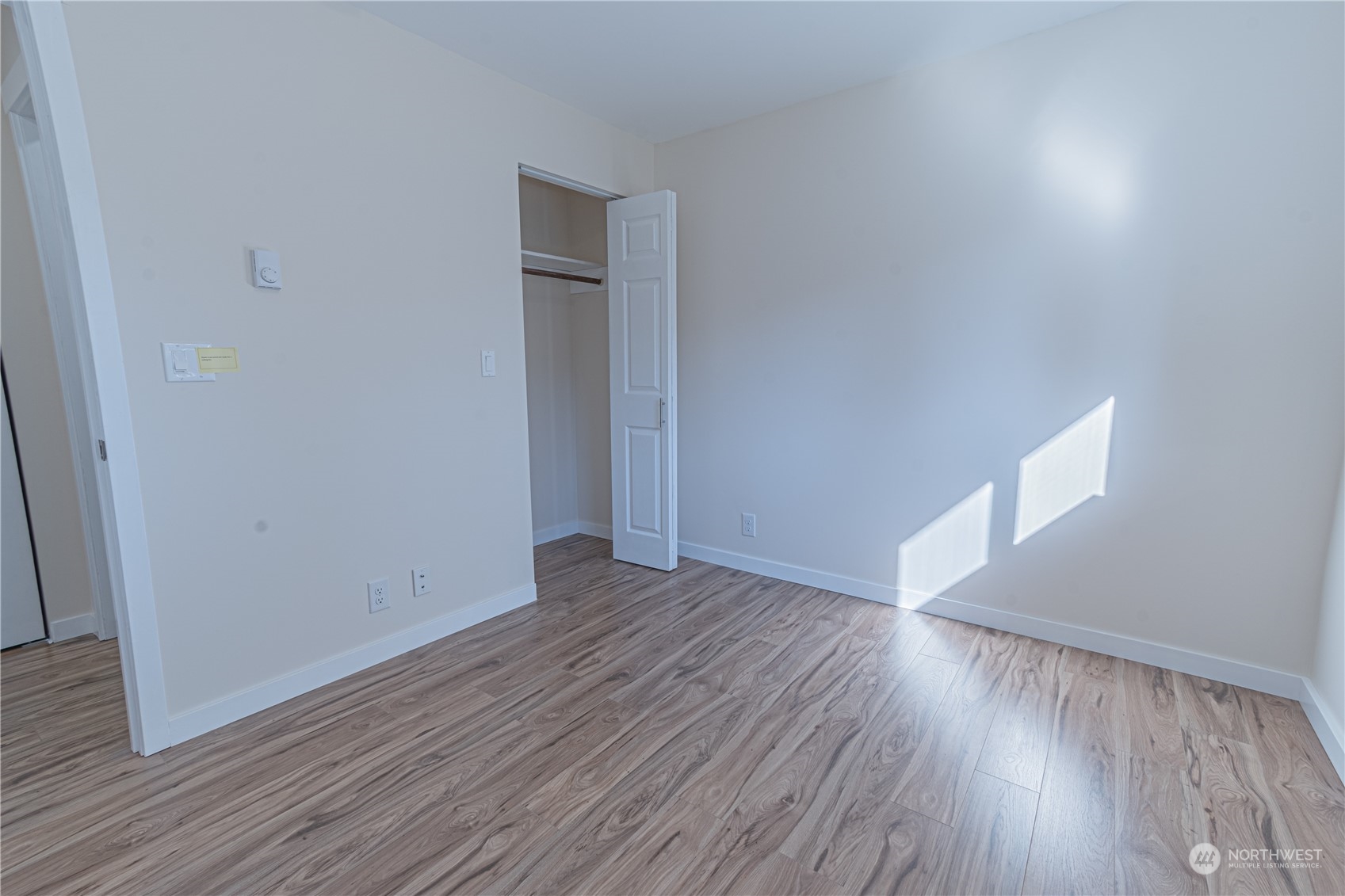 1125 Southwest 356th Street Federal Way, WA 98023 - Photo 19 of 27 a view of an empty room with wooden floor and a window