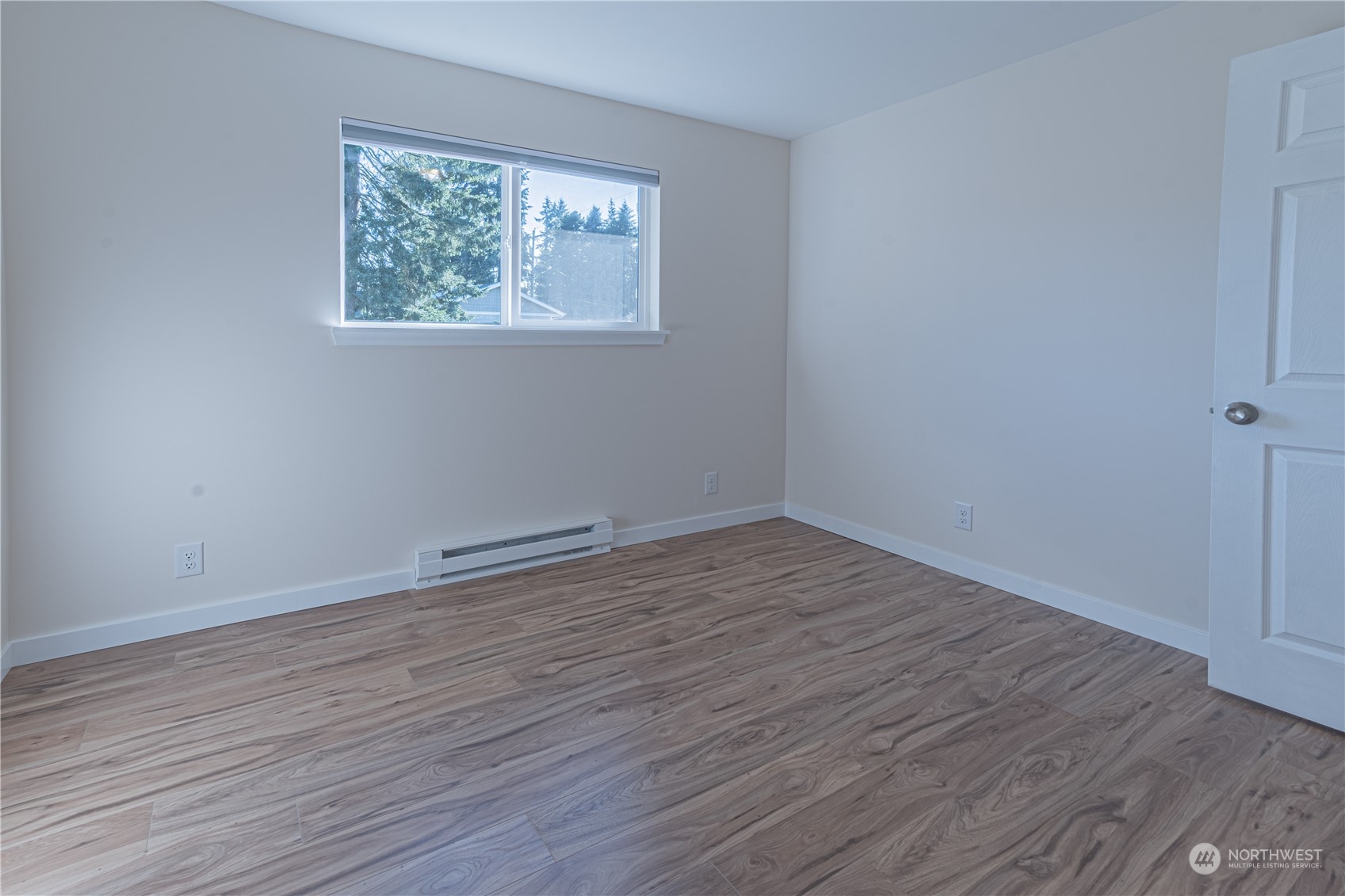 1125 Southwest 356th Street Federal Way, WA 98023 - Photo 20 of 27 an empty room with wooden floor and windows