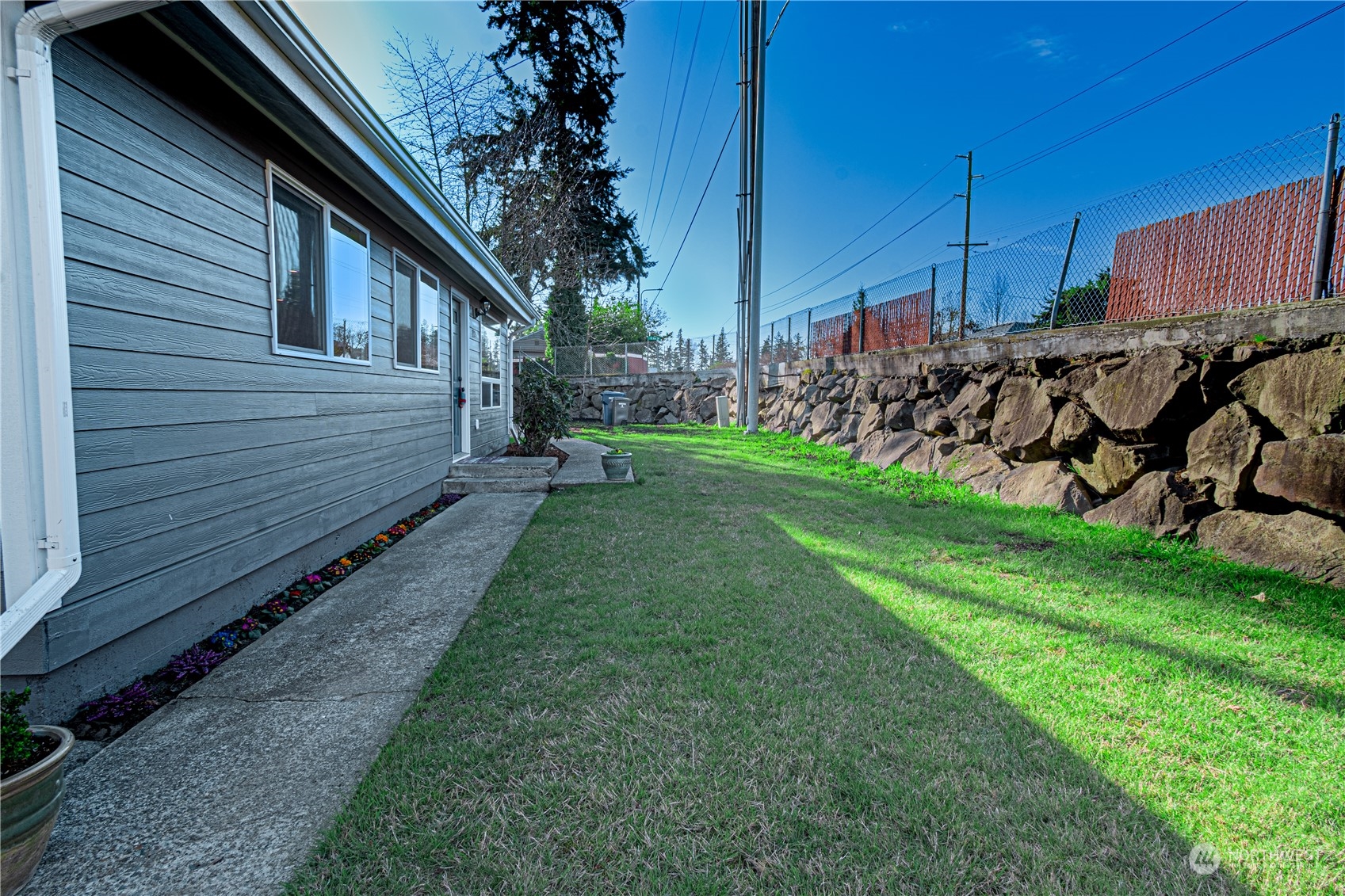 1125 Southwest 356th Street Federal Way, WA 98023 - Photo 27 of 27 a view of a backyard with wooden fence