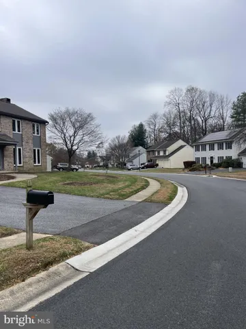 a view of a park with swings and slides