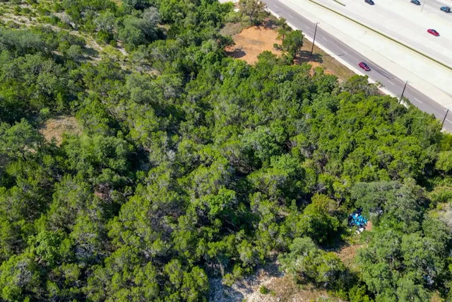 a view of a balcony with an outdoor space and seating area
