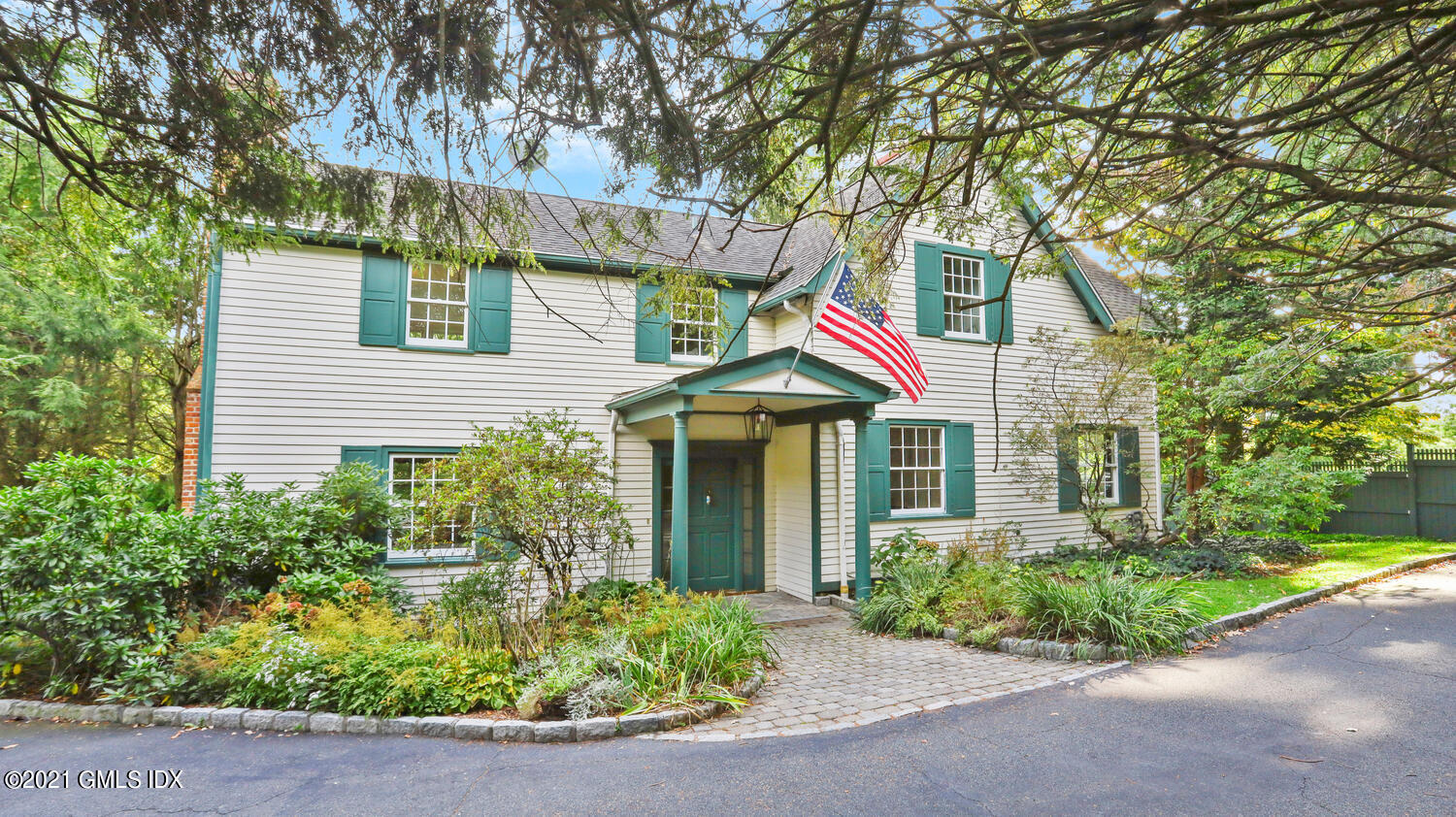 23 Parsonage Road Greenwich, CT 06830 - Photo 1 of 29 a front view of a house with porch