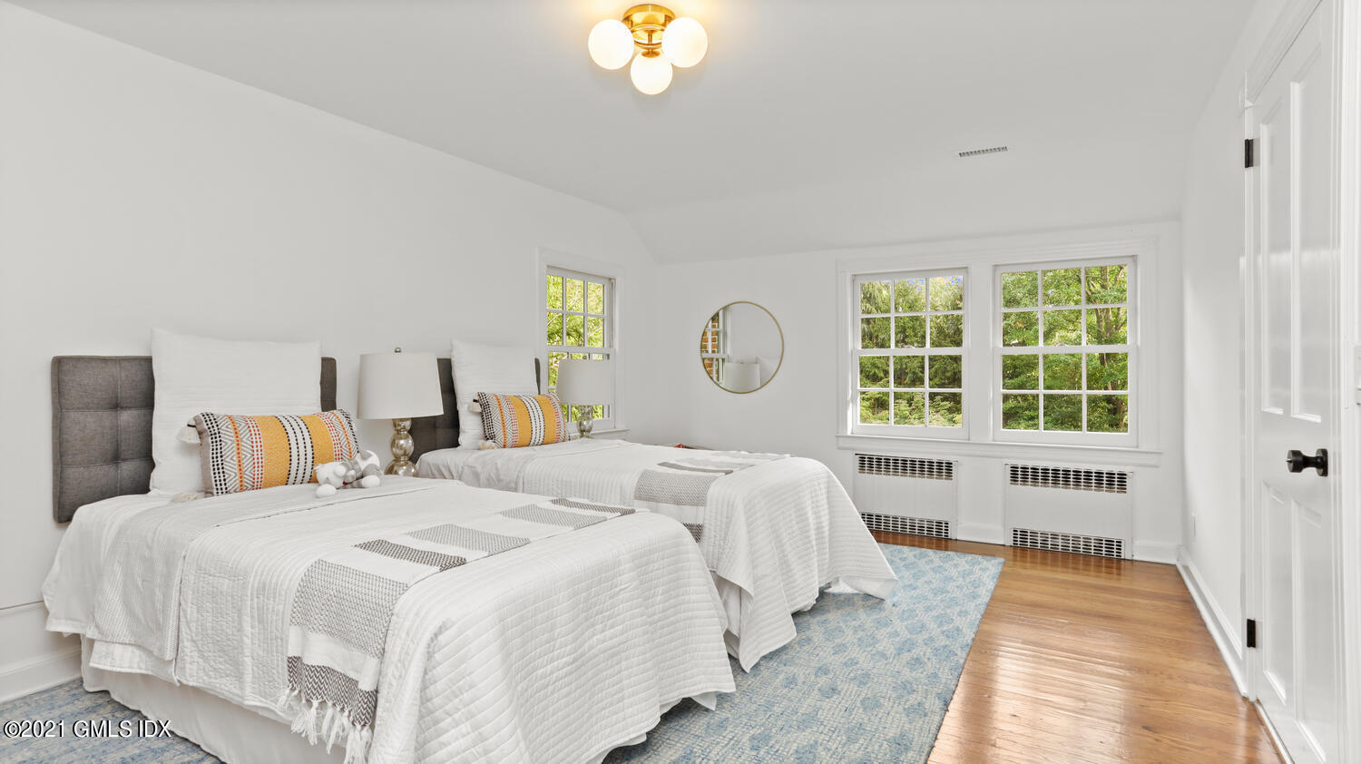 23 Parsonage Road Greenwich, CT 06830 - Photo 16 of 29 a bedroom with a large bed and a window