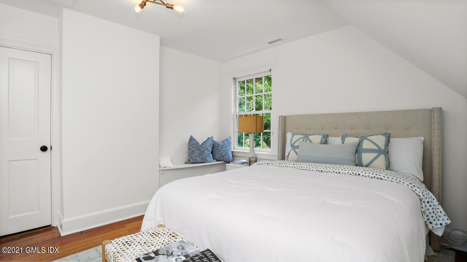 23 Parsonage Road Greenwich, CT 06830 - Photo 17 of 29 a bedroom with a bed and a window