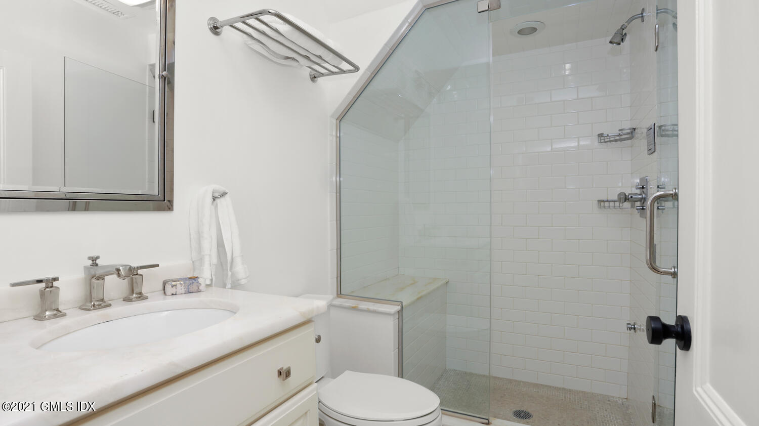 23 Parsonage Road Greenwich, CT 06830 - Photo 22 of 29 a bathroom with a granite countertop sink toilet a mirror and shower