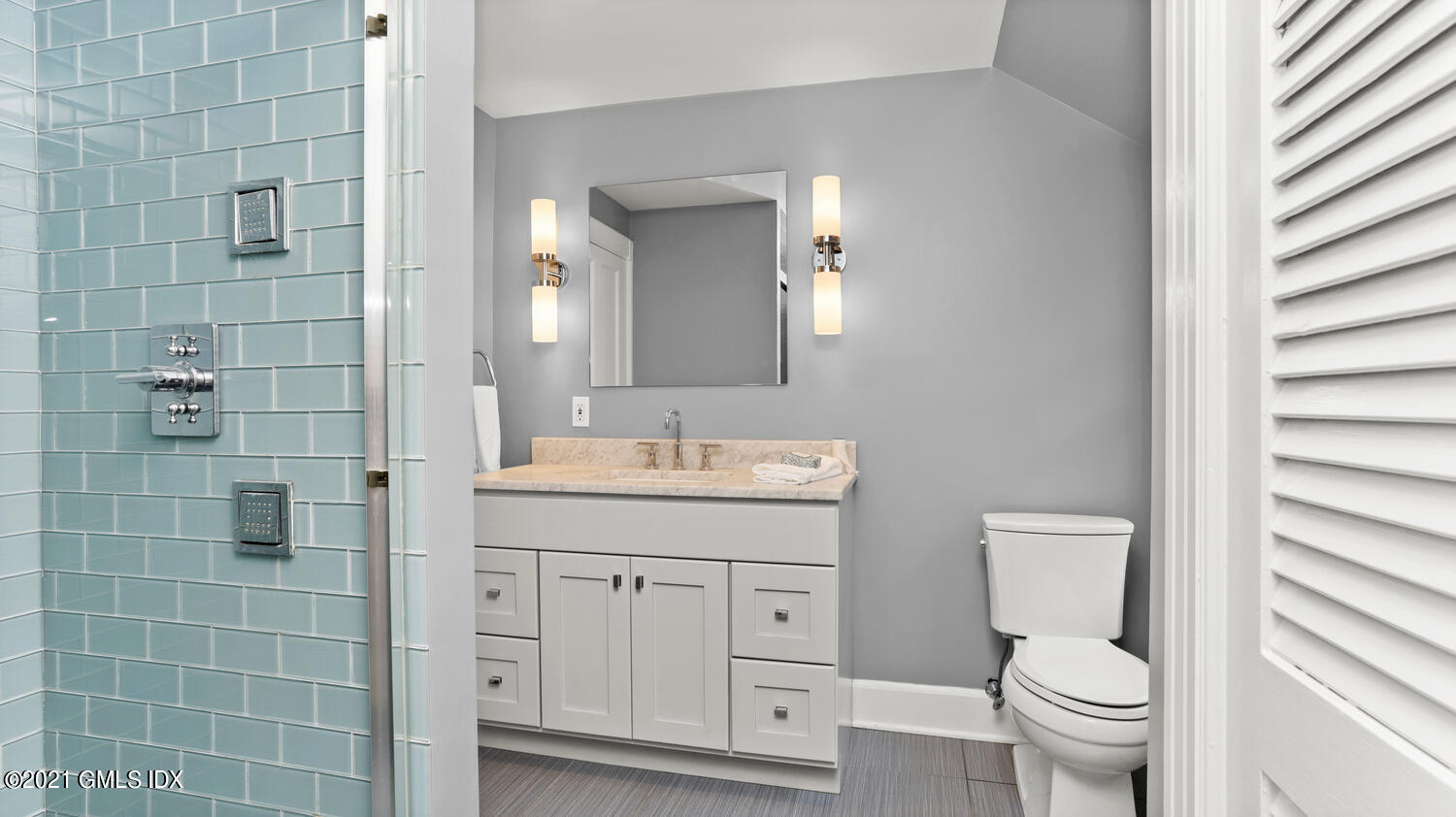 23 Parsonage Road Greenwich, CT 06830 - Photo 23 of 29 a bathroom with a granite countertop toilet a sink and a mirror