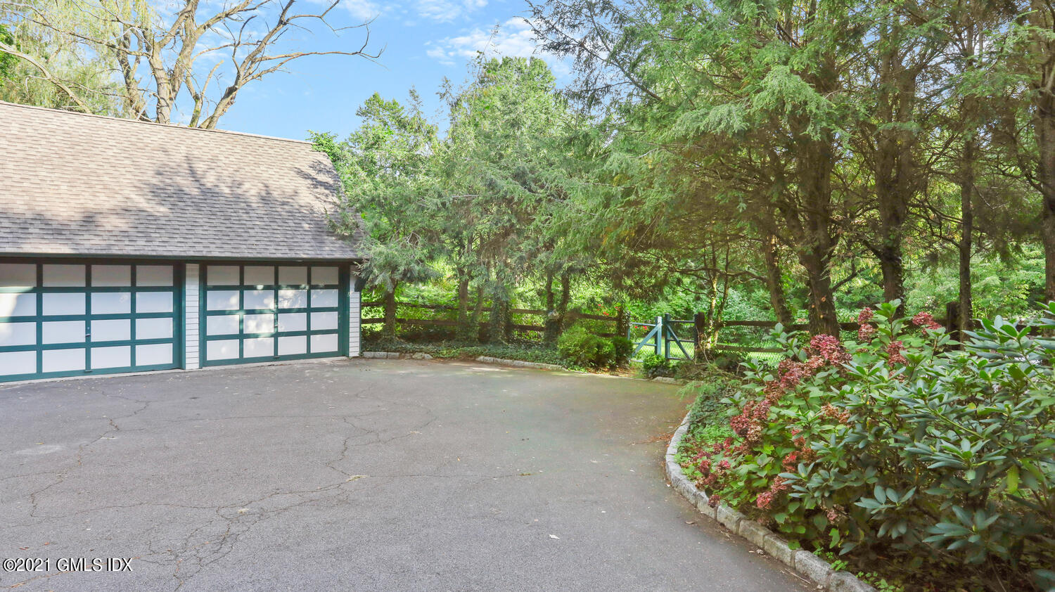 23 Parsonage Road Greenwich, CT 06830 - Photo 4 of 29 a view of a house with a outdoor space and garden