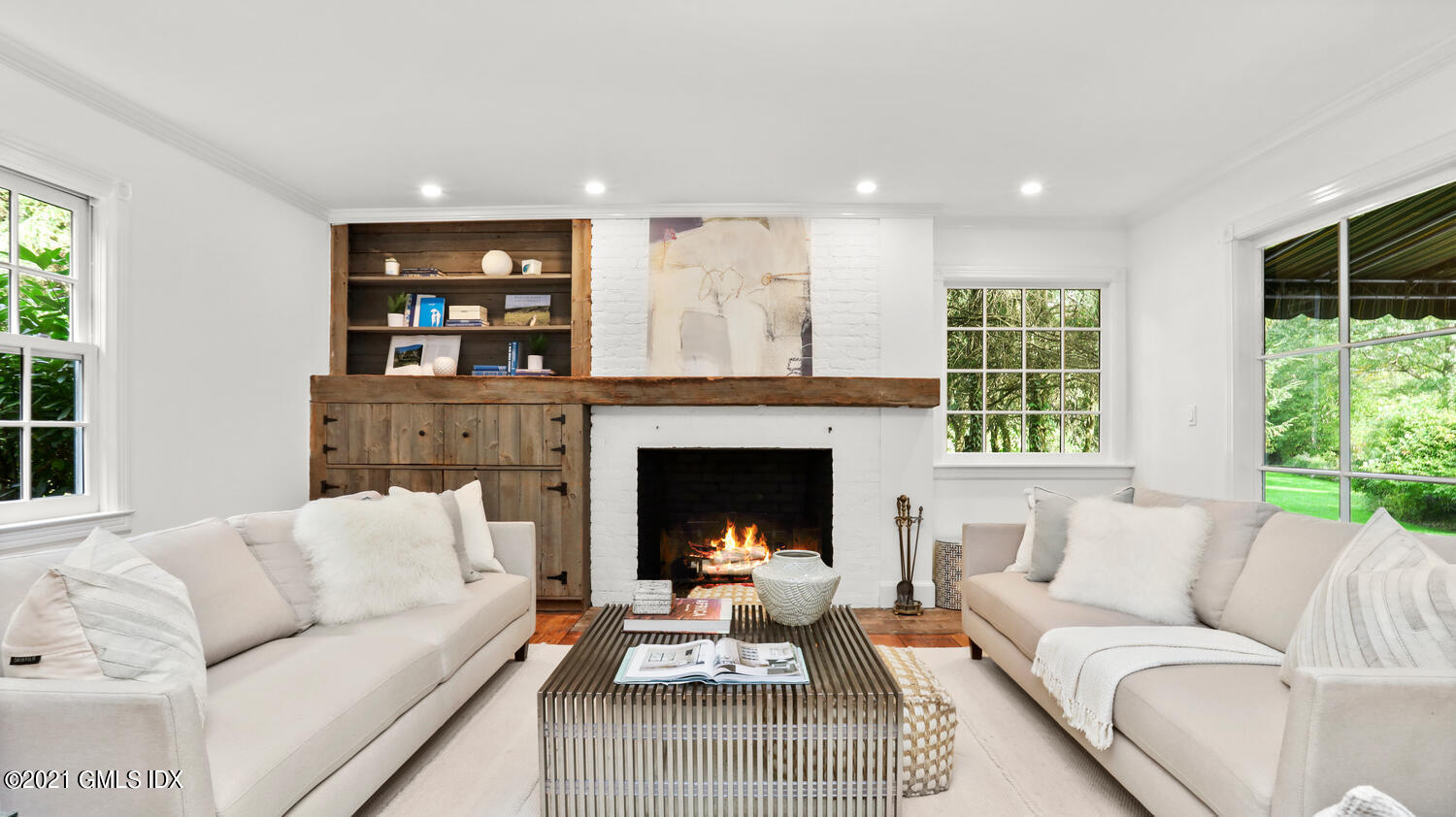23 Parsonage Road Greenwich, CT 06830 - Photo 6 of 29 a living room with furniture and a fireplace