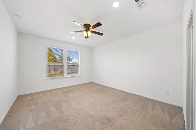 a view of a big room with carpet