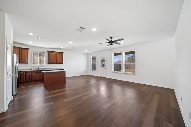 a view of kitchen with wooden floor and windows