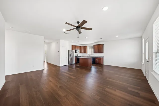 a view of a kitchen with a sink and a stove top oven