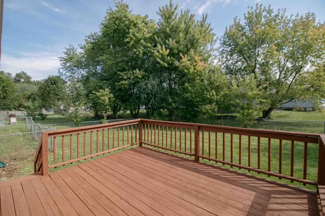 a view of deck with wooden floor and fence