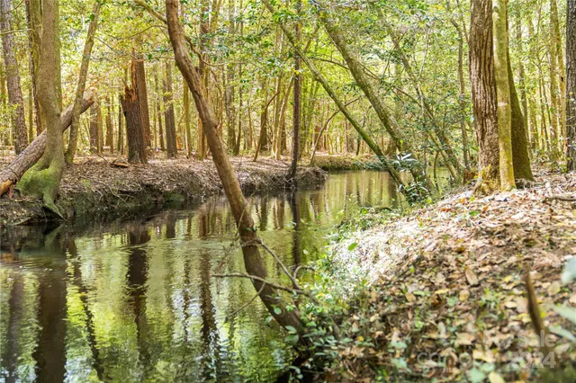 a view of living room with furniture and floor to ceiling windows