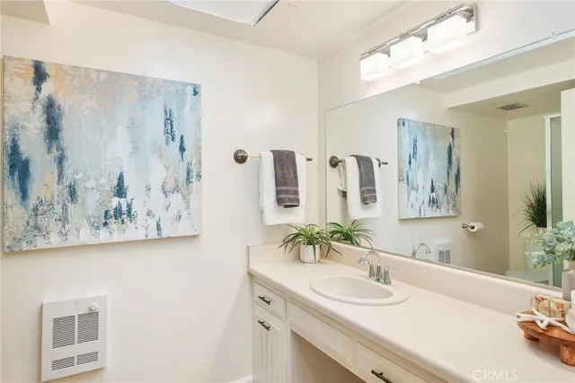 a bedroom with a bed and cabinets