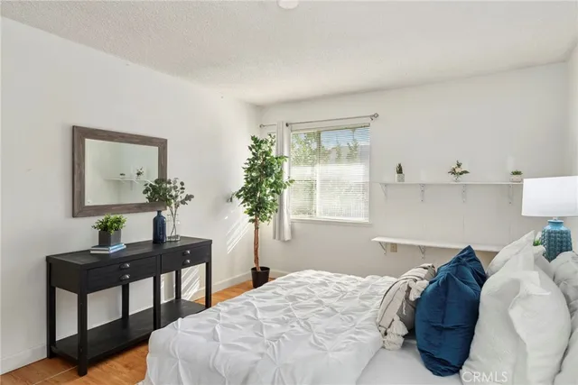 a bedroom with a bed and a table in it