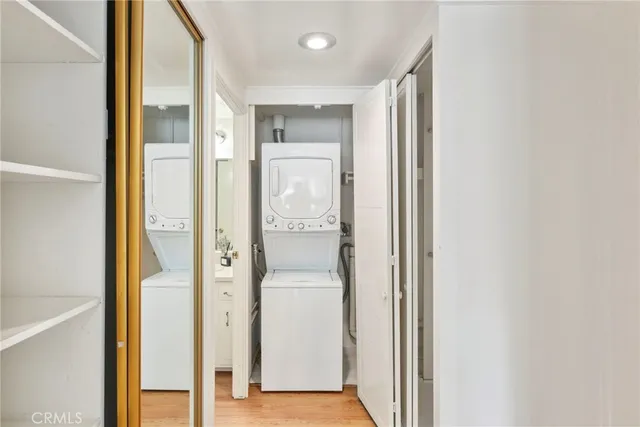 a bedroom with a bed table and a potted plant