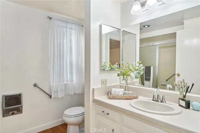 a bathroom with a glass shower door
