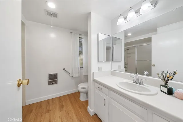 a view of a bathroom with a glass door