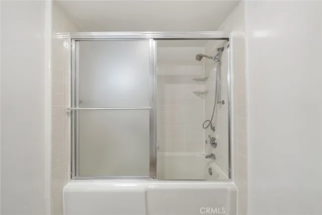 a view of a bathroom with a glass door
