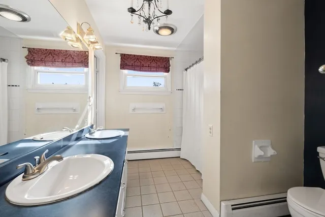 a bathroom with a sink double vanity and a mirror