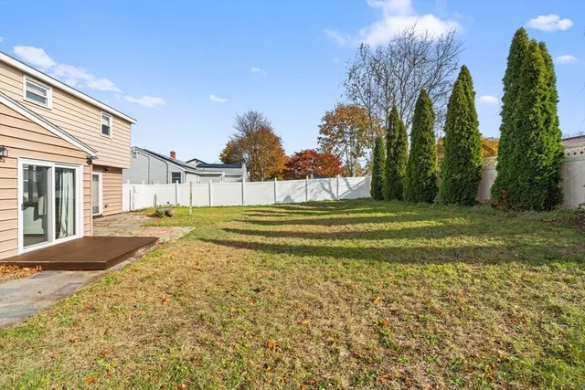 a view of a house with a backyard